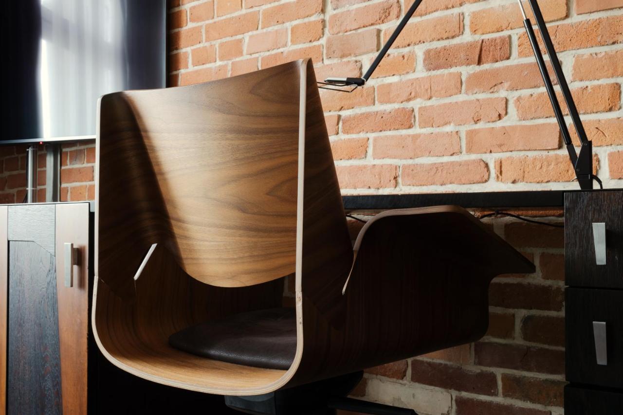 Hotel Monopol Wrocław Kültér fotó A chair made of bent plywood
